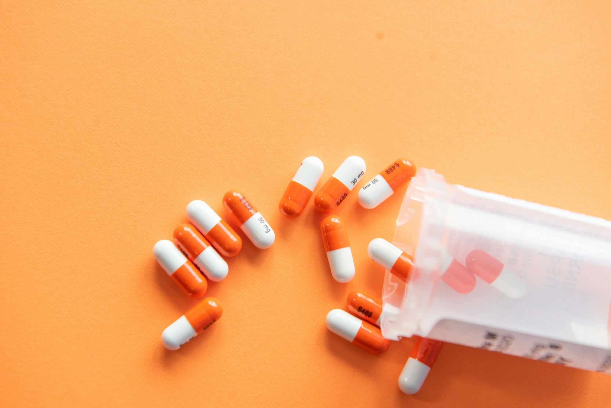 Pharmacy shelves lined with organized medication bottles